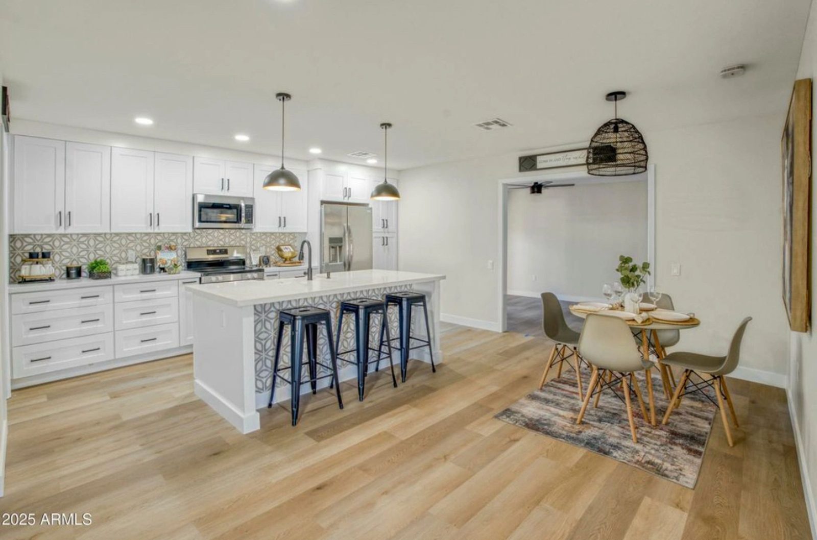 Renovated white kitchen with island in a Phoenix flip